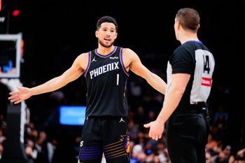 Feb 10, 2026; Phoenix, Arizona, USA; Phoenix Suns guard Devin Booker (1) questions a ref in the second half of the game against the Dallas Mavericks at Mortgage Matchup Center. Mandatory Credit: Arianna Grainey-Imagn Images