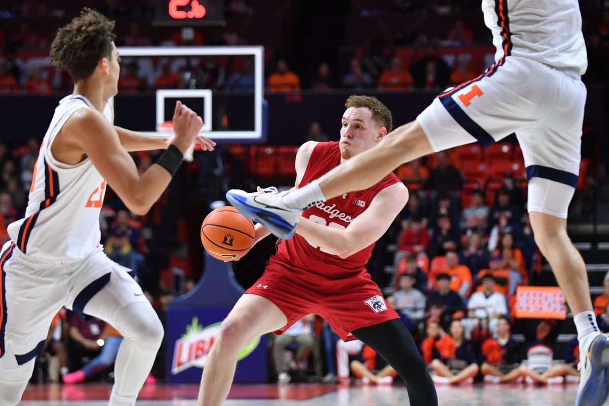 Feb 10, 2026; Champaign, Illinois, USA; Wisconsin Badgers forward Austin Rapp (22) drives the ball during the second half against the Wisconsin Badgers at State Farm Center. Mandatory Credit: Ron Johnson-Imagn Images