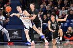 Feb 10, 2026; Spokane, Washington, USA; Gonzaga Bulldogs guard Mario Saint-Supery (17) passes the ball against Washington State Cougars forward Rihards Vavers (15) in the second half at McCarthey Athletic Center. Mandatory Credit: James Snook-Imagn Images