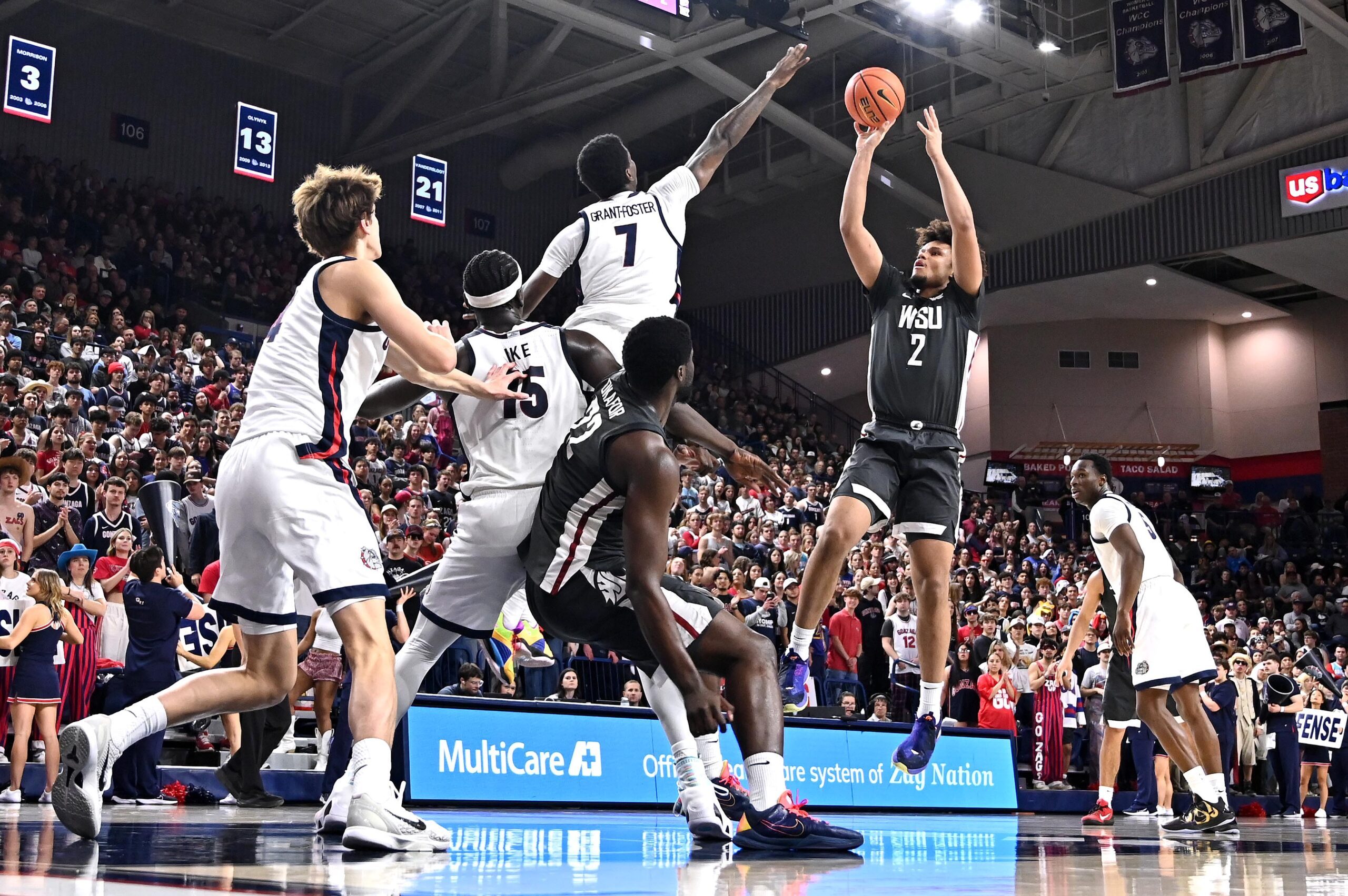 Feb 10, 2026; Spokane, Washington, USA; Washington State Cougars forward Eemeli Yalaho (2) shoots the ball against Gonzaga Bulldogs guard Tyon Grant-Foster (7) in the second half at McCarthey Athletic Center. Mandatory Credit: James Snook-Imagn Images