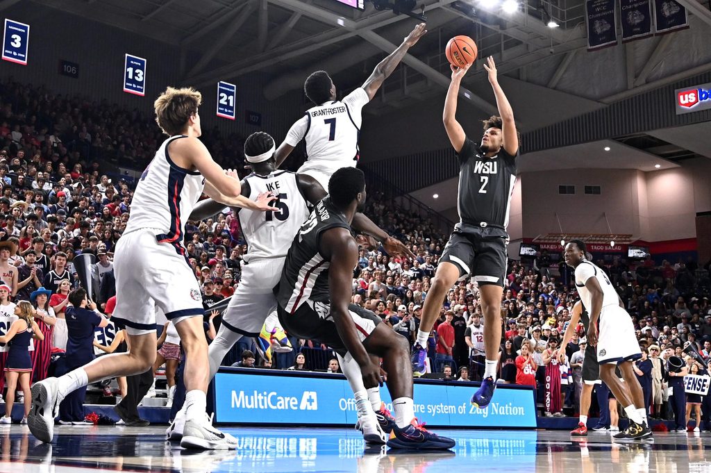 Feb 10, 2026; Spokane, Washington, USA; Washington State Cougars forward Eemeli Yalaho (2) shoots the ball against Gonzaga Bulldogs guard Tyon Grant-Foster (7) in the second half at McCarthey Athletic Center. Mandatory Credit: James Snook-Imagn Images