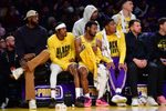 Feb 10, 2026; Los Angeles, California, USA; Los Angeles Lakers forward LeBron James (23) forward Jarred Vanderbilt (2) guard Bronny James (9) and forward Rui Hachimura (28) watch game action during the second half at Crypto.com Arena. Mandatory Credit: Gary A. Vasquez-Imagn Images