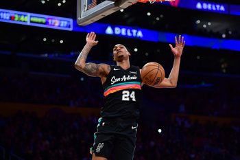 Feb 10, 2026; Los Angeles, California, USA; San Antonio Spurs guard Devin Vassell (24) scores a basket against the Los Angeles Lakers during the second half at Crypto.com Arena. Mandatory Credit: Gary A. Vasquez-Imagn Images