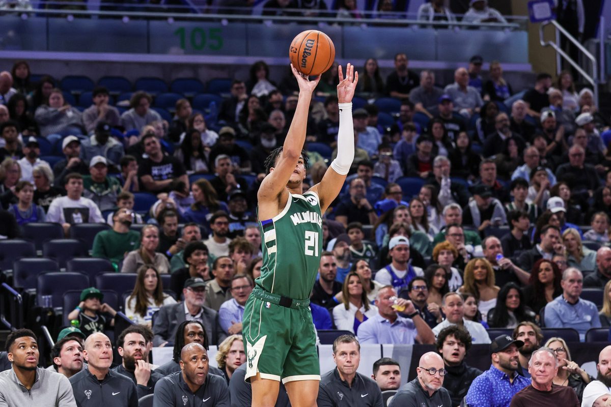 Feb 11, 2026; Orlando, Florida, USA; Milwaukee Bucks forward Ousmane Dieng (21) shoots a three point basket during the second quarter against the Orlando Magic at Kia Center. Mandatory Credit: Mike Watters-Imagn Images