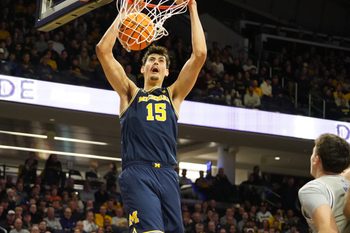 Feb 11, 2026; Evanston, Illinois, USA; Michigan Wolverines center Aday Mara (15) dunks the ball against the Northwestern Wildcats during the first half at Welsh-Ryan Arena. Mandatory Credit: David Banks-Imagn Images