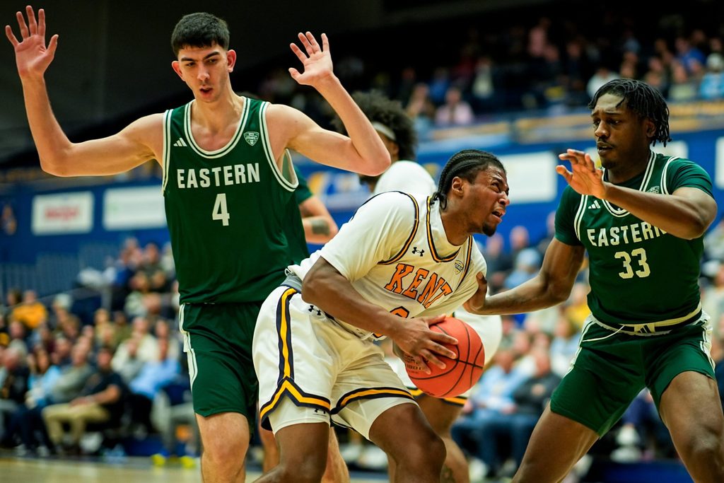 Kent State University’s Morgan Safford (8) looks to shoot while guarded by Eastern Michigan University’s Mohammad Habhab (4) and Eastern Michigan University’s John Shanu II (33), Feb. 11, 2026, at M.A.C. Center in Kent, Ohio.