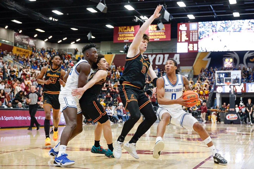 Feb 13, 2026; Chicago, Illinois, USA; Saint Louis Billikens guard Kellen Thames (0) drives to the basket against the Loyola Chicago Ramblers during the first half at Joseph J. Gentile Arena. Mandatory Credit: Kamil Krzaczynski-Imagn Images
