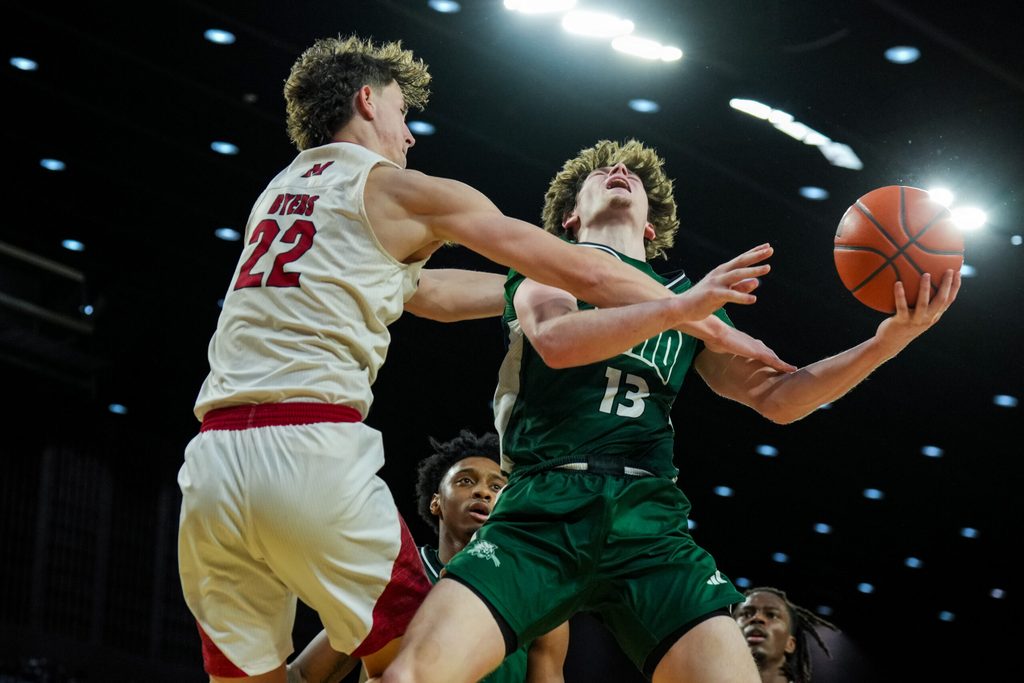 Feb 13, 2026; Miami, Ohio, USA; Ohio Bobcats guard Jackson Paveletzke (13) reacts as the drives to the basket against Miami (OH) RedHawks forward Brant Byers (22) in the second half at Millett Hall. Mandatory Credit: Aaron Doster-Imagn Images