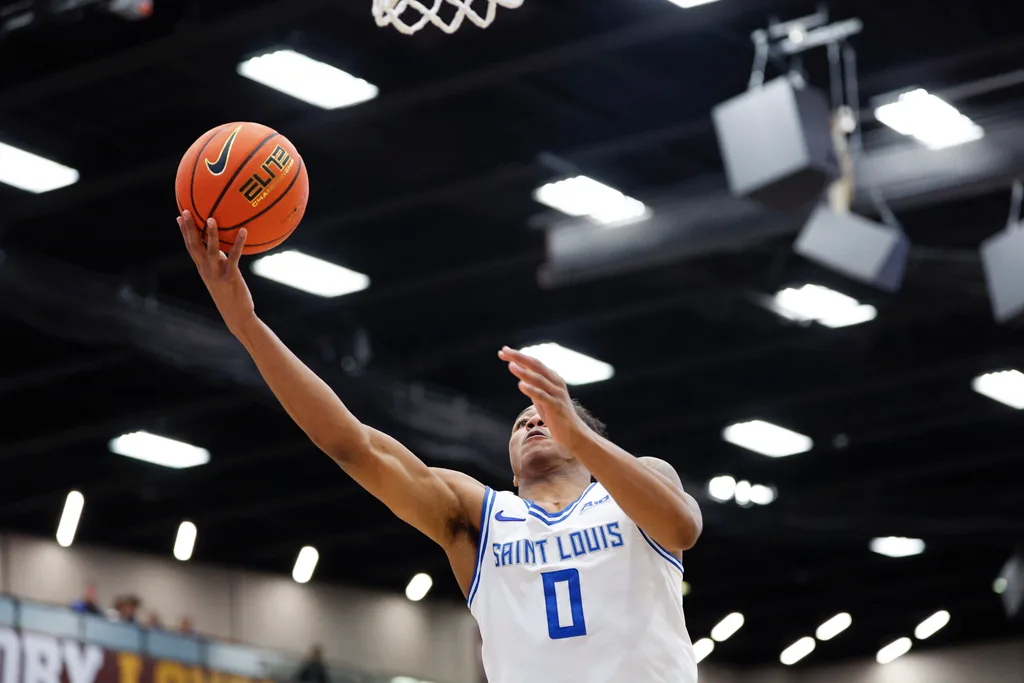 Feb 13, 2026; Chicago, Illinois, USA; Saint Louis Billikens guard Kellen Thames (0) goes to the basket against the Loyola Chicago Ramblers during the first half at Joseph J. Gentile Arena. Mandatory Credit: Kamil Krzaczynski-Imagn Images