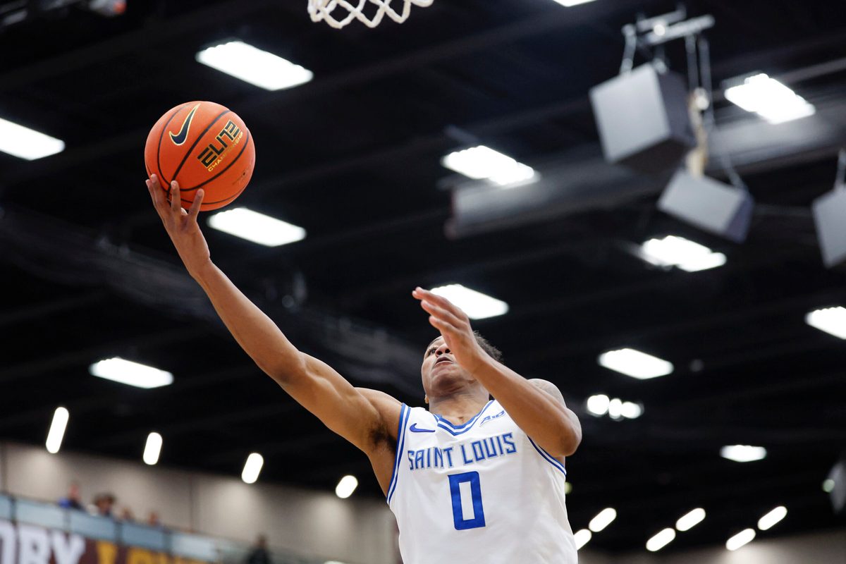 Feb 13, 2026; Chicago, Illinois, USA; Saint Louis Billikens guard Kellen Thames (0) goes to the basket against the Loyola Chicago Ramblers during the first half at Joseph J. Gentile Arena. Mandatory Credit: Kamil Krzaczynski-Imagn Images