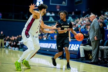 Akron Zips’ Tavari Johnson (5) looks to pass against UMass, Feb. 13, 2026, at James A Rhodes Arena in Akron, Ohio.