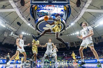 Feb 14, 2026; South Bend, Indiana, USA; Georgia Tech Yellow Jackets forward Kowacie Reeves Jr. (14) drives to the basket against the Notre Dame Fighting Irish during the first half at Purcell Pavilion at the Joyce Center. Mandatory Credit: Michael Caterina-Imagn Images
