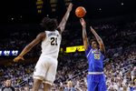 Feb 14, 2026; Ann Arbor, Michigan, USA; UCLA Bruins guard Skyy Clark (55) shoots on Michigan Wolverines forward Morez Johnson Jr. (21) in the second half at Crisler Center. Mandatory Credit: Rick Osentoski-Imagn Images