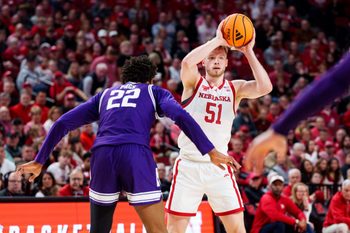 Feb 14, 2026; Lincoln, Nebraska, USA; Nebraska Cornhuskers forward Rienk Mast (51) looks to pass against Northwestern Wildcats forward Arrinten Page (22) during the first half at Pinnacle Bank Arena. Mandatory Credit: Dylan Widger-Imagn Images