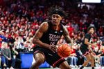 Feb 14, 2026; Tucson, Arizona, USA; Texas Tech Red Raiders forward JT Toppin (15) dribbles and dunks the ball during the first half of the game against the Arizona Wildcats at McKale Memorial Center. Mandatory Credit: Aryanna Frank-Imagn Images