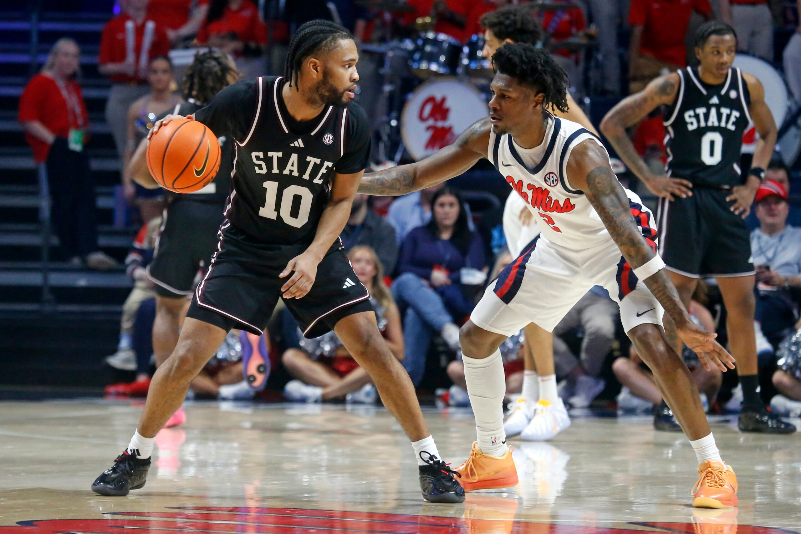 Feb 14, 2026; Oxford, Mississippi, USA; Mississippi State Bulldogs guard Jayden Epps (10) dribbles as Mississippi Rebels guard AJ Storr (2) defends during the second half at The Sandy and John Black Pavilion at Ole Miss. Mandatory Credit: Petre Thomas-Imagn Images