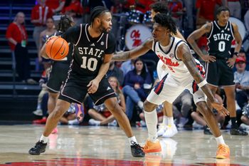 Feb 14, 2026; Oxford, Mississippi, USA; Mississippi State Bulldogs guard Jayden Epps (10) dribbles as Mississippi Rebels guard AJ Storr (2) defends during the second half at The Sandy and John Black Pavilion at Ole Miss. Mandatory Credit: Petre Thomas-Imagn Images
