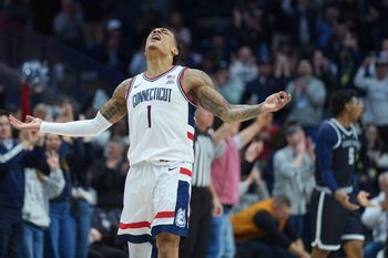 Feb 14, 2026; Storrs, Connecticut, USA; UConn Huskies guard Solo Ball (1) reacts after his three point basket against the Georgetown Hoyas in the second half at Harry A. Gampel Pavilion. Mandatory Credit: David Butler II-Imagn Images