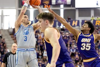 Drake guard Jalen Quinn (3) shoots the basketball as UNI’s Leon Bond III (35) defends Feb. 15, 2026 during a Missouri Valley Conference game at the McLeod Center in Cedar Falls, Iowa.