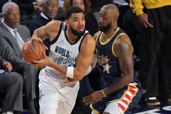 Feb 15, 2026; Inglewood, California, USA; Team World forward Karl-Anthony Towns (32) of the New York Knicks controls the ball against Team USA Stripes forward LeBron James (23) of the Los Angeles Lakers in game three during the 75th NBA All Star Game at Intuit Dome. Mandatory Credit: Jayne Kamin-Oncea-Imagn Images