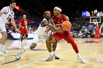 Feb 17, 2026; Dallas, Texas, USA; SMU Mustangs guard Boopie Miller (2) attempts to knock the ball away from Louisville Cardinals guard Ryan Conwell (3) during the first half at Moody Coliseum. Mandatory Credit: Jerome Miron-Imagn Images