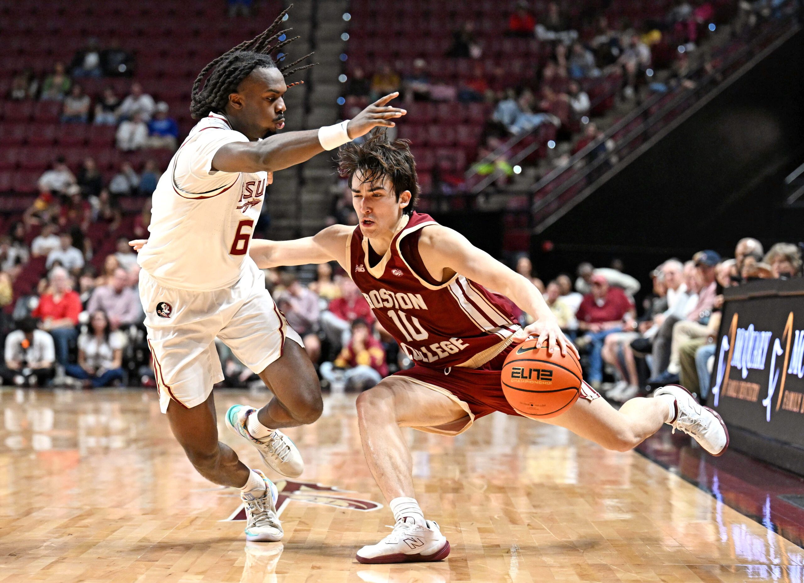 Feb 17, 2026; Tallahassee, Florida, USA; Boston College Eagles guard Luka Toews (10) drives the ball to the net against Florida State Seminoles guard Robert McCray (6) during the second half at Donald L. Tucker Center. Mandatory Credit: Melina Myers-Imagn Images
