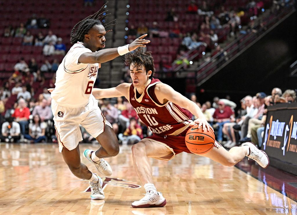 Feb 17, 2026; Tallahassee, Florida, USA; Boston College Eagles guard Luka Toews (10) drives the ball to the net against Florida State Seminoles guard Robert McCray (6) during the second half at Donald L. Tucker Center. Mandatory Credit: Melina Myers-Imagn Images