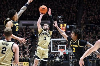 Feb 17, 2026; West Lafayette, Indiana, USA; Purdue Boilermakers guard Braden Smith (3) shoots the ball against Michigan Wolverines forward Yaxel Lendeborg (23) during the second half at Mackey Arena. Mandatory Credit: Marc Lebryk-Imagn Images