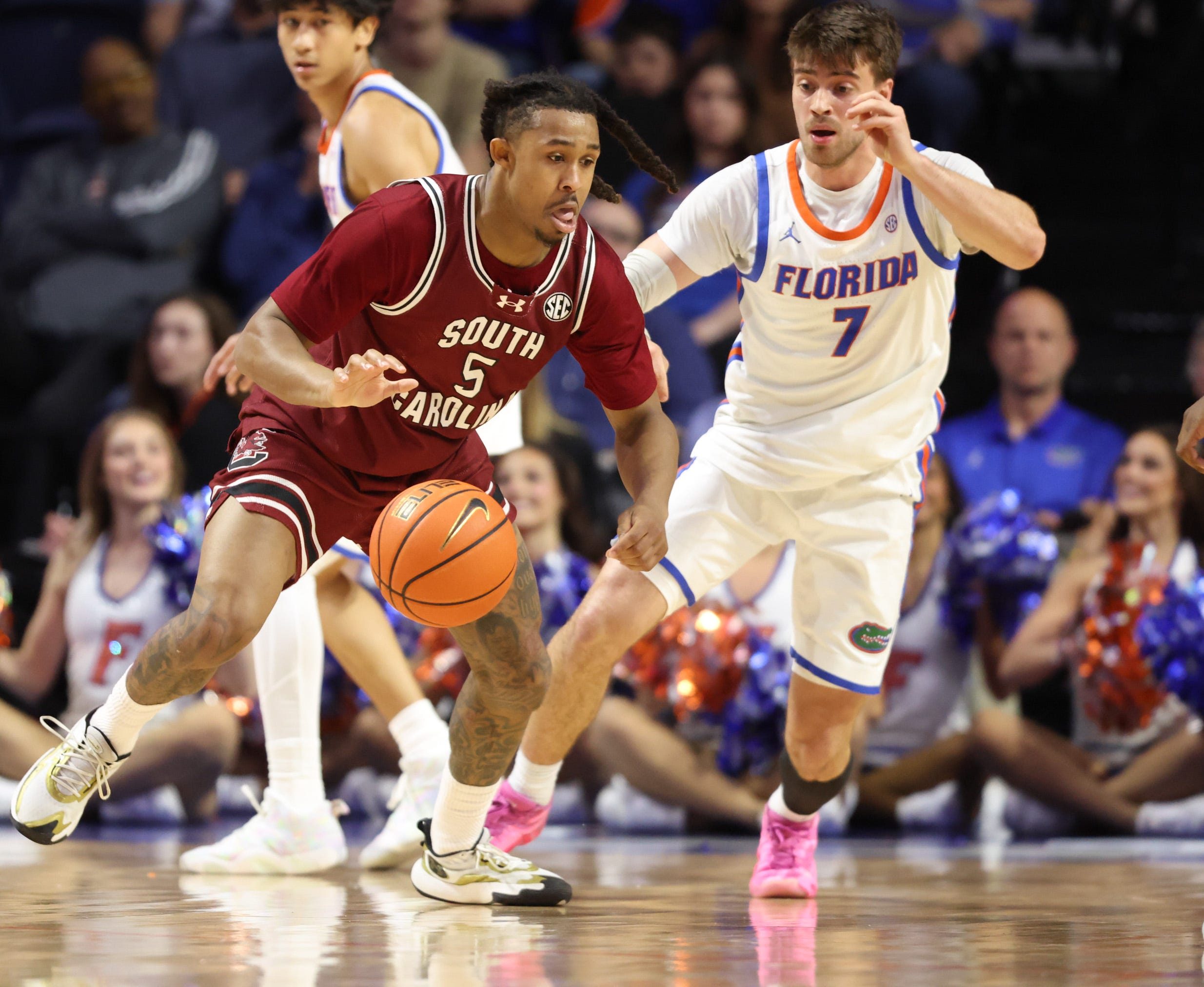 South Carolina guard Meechie Johnson (5) tries to keep the ball against the Florida during the first half of a NCAA mens basketball game at Steven C. O'Connell Center Exactek arena in Gainesville, FL on Tuesday, February 17, 2026. [Alan Youngblood/Gainesville Sun]
