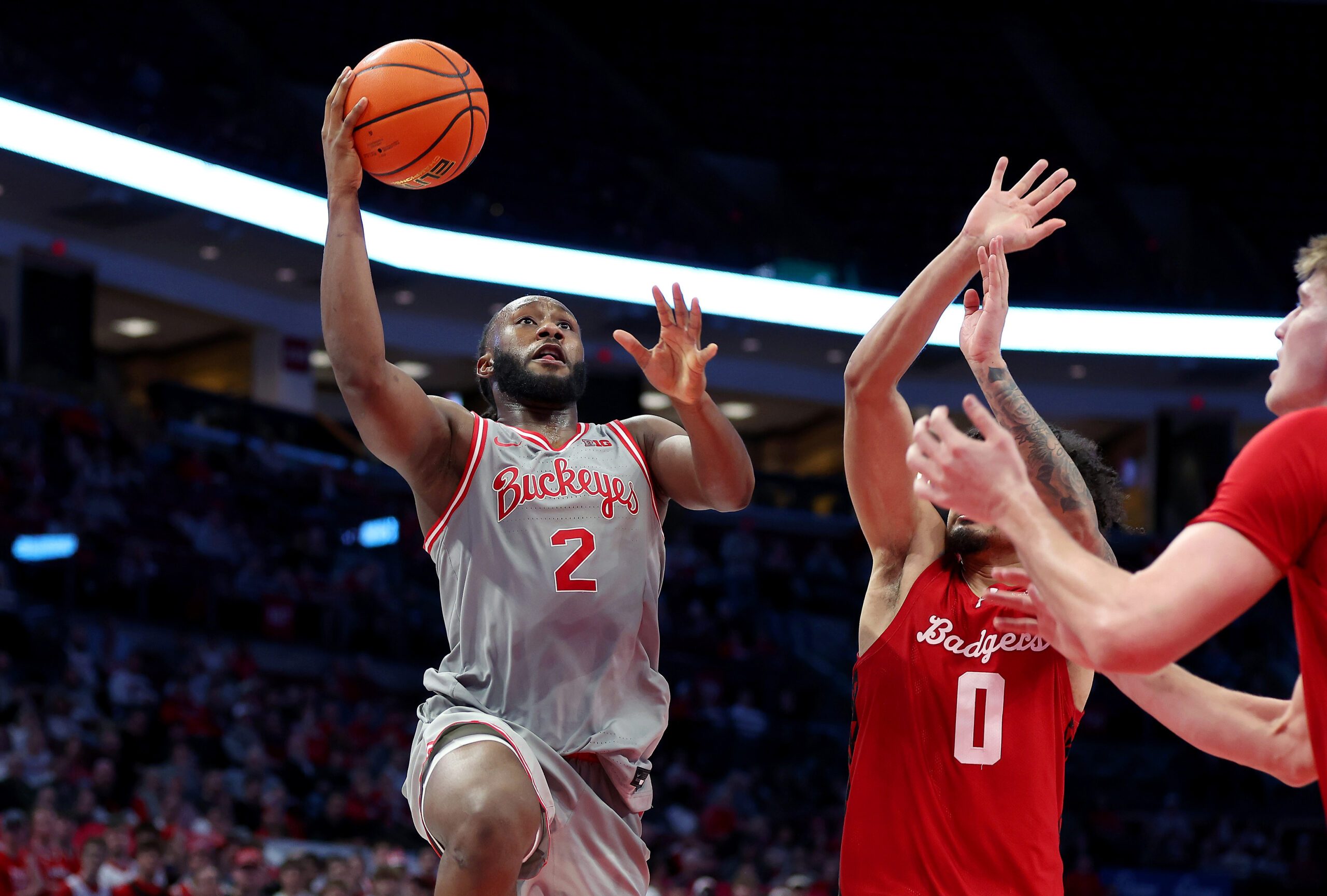 Feb 17, 2026; Columbus, Ohio, USA;  Ohio State Buckeyes guard Bruce Thornton (2) drives to the basket as Wisconsin Badgers guard Braeden Carrington (0) defends during the second half at Value City Arena. Mandatory Credit: Joseph Maiorana-Imagn Images