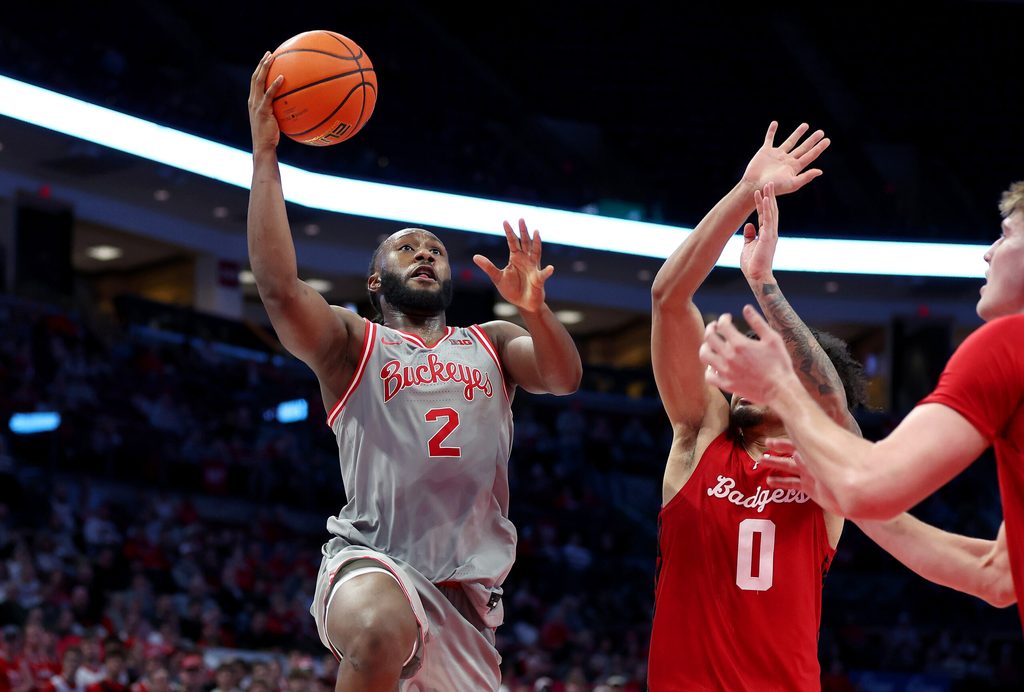 Feb 17, 2026; Columbus, Ohio, USA; Ohio State Buckeyes guard Bruce Thornton (2) drives to the basket as Wisconsin Badgers guard Braeden Carrington (0) defends during the second half at Value City Arena. Mandatory Credit: Joseph Maiorana-Imagn Images