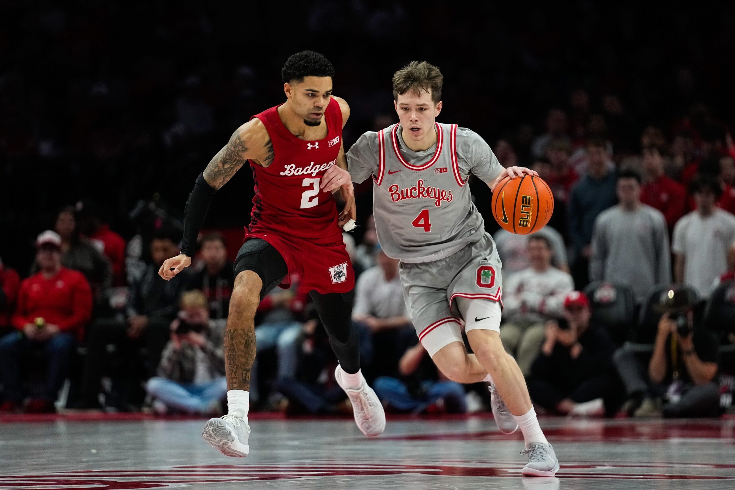 Ohio State Buckeyes guard Gabe Cupps (4) dribbles the ball against Wisconsin Badgers guard Nick Boyd (2) in the second half of the NCAA game at Value City Arena on Tuesday, Feb. 17, 2026 in Columbus, Ohio.
