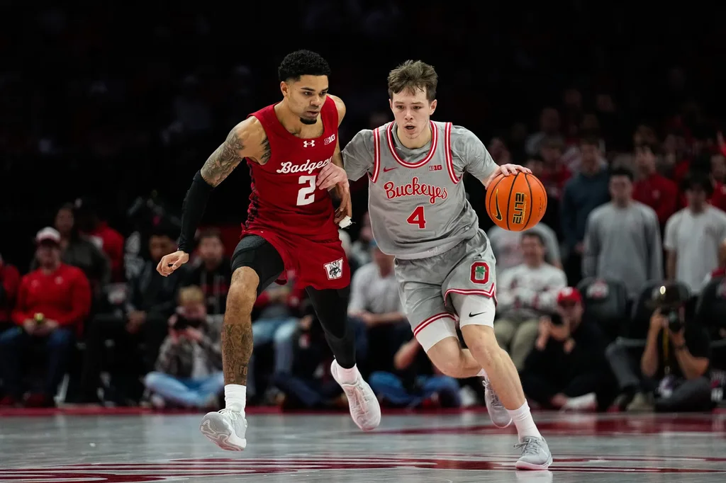 Ohio State Buckeyes guard Gabe Cupps (4) dribbles the ball against Wisconsin Badgers guard Nick Boyd (2) in the second half of the NCAA game at Value City Arena on Tuesday, Feb. 17, 2026 in Columbus, Ohio.