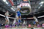 Feb 17, 2026; East Lansing, Michigan, USA; UCLA Bruins forward Tyler Bilodeau (34) tries a reverse shot off the glass during the first half against the Michigan State Spartans at Jack Breslin Student Events Center. Mandatory Credit: Dale Young-Imagn Images