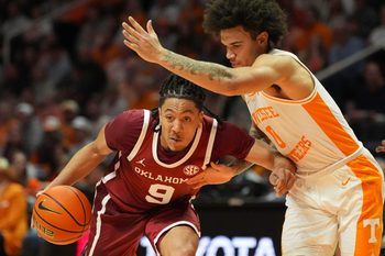 Oklahoma guard Nijel Pack (9) trues to get to the basket while guarded by Tennessee guard Ja’Kobi Gillespie (0) during an NCAA college basketball game on Feb. 18, 2026, in Knoxville, Tennessee.