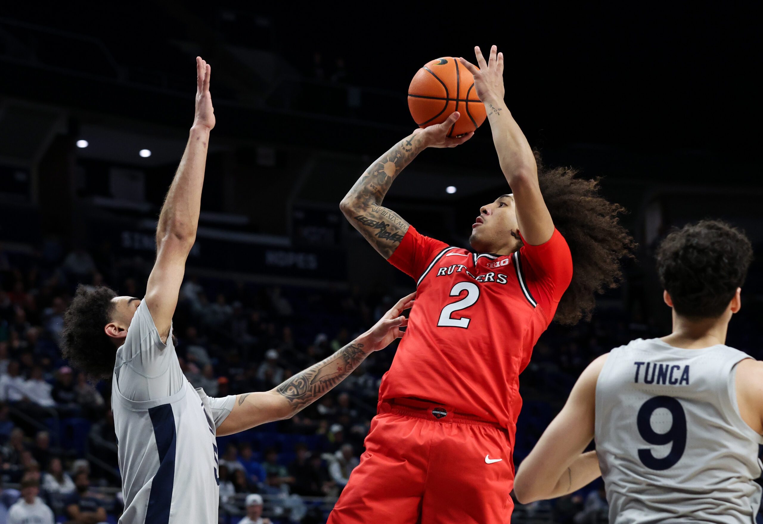 Feb 18, 2026; University Park, Pennsylvania, USA; Rutgers Scarlet Knights guard Lino Mark (2) shoots the ball as Penn State Nittany Lions guard Freddie Dilione V (5) defends during the second half at Bryce Jordan Center. Mandatory Credit: Matthew O'Haren-Imagn Images