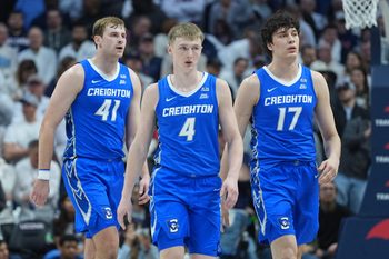 Feb 18, 2026; Storrs, Connecticut, USA; Creighton Bluejays guard Josh Dix (4), forward Isaac Traudt (41) and forward Kerem Konan (17) make their way top the bench during a break against the UConn Huskies in the second half at Harry A. Gampel Pavilion. Mandatory Credit: David Butler II-Imagn Images