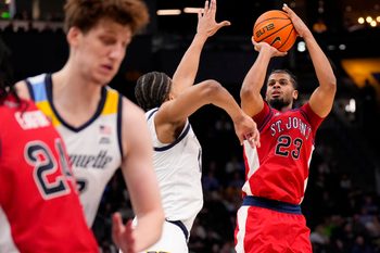 Feb 18, 2026; Milwaukee, Wisconsin, USA;  St. John’s Red Storm guard-forward Bryce Hopkins (23) shoots during the first half against the Marquette Golden Eagles at Fiserv Forum. Mandatory Credit: Jeff Hanisch-Imagn Images