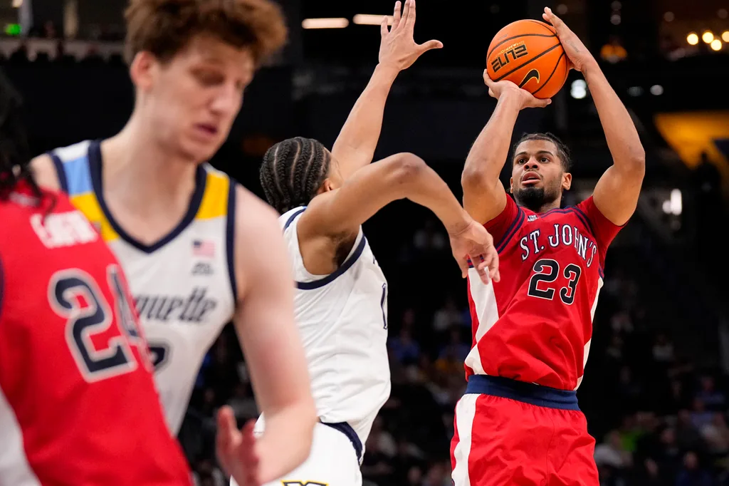 Feb 18, 2026; Milwaukee, Wisconsin, USA; St. John’s Red Storm guard-forward Bryce Hopkins (23) shoots during the first half against the Marquette Golden Eagles at Fiserv Forum. Mandatory Credit: Jeff Hanisch-Imagn Images