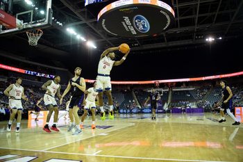 Illinois Chicago's Ahmad Henderson II (0) grabs a rebound as the University of Evansville Purple Aces play the University of Illinois Chicago Flames at Ford Center in Evansville, Ind., Wednesday, Feb. 18, 2026.