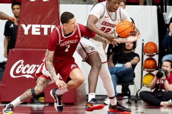 Feb 18, 2026; Tuscaloosa, AL, USA; Arkansas forward Trevon Brazile (7) and Alabama forward Aiden Sherrell (22) fight for a loose ball at Coleman Coliseum. Alabama defeated Arkansas 117-115 in double overtime. Mandatory Credit: Gary Cosby Jr.-Tuscaloosa News