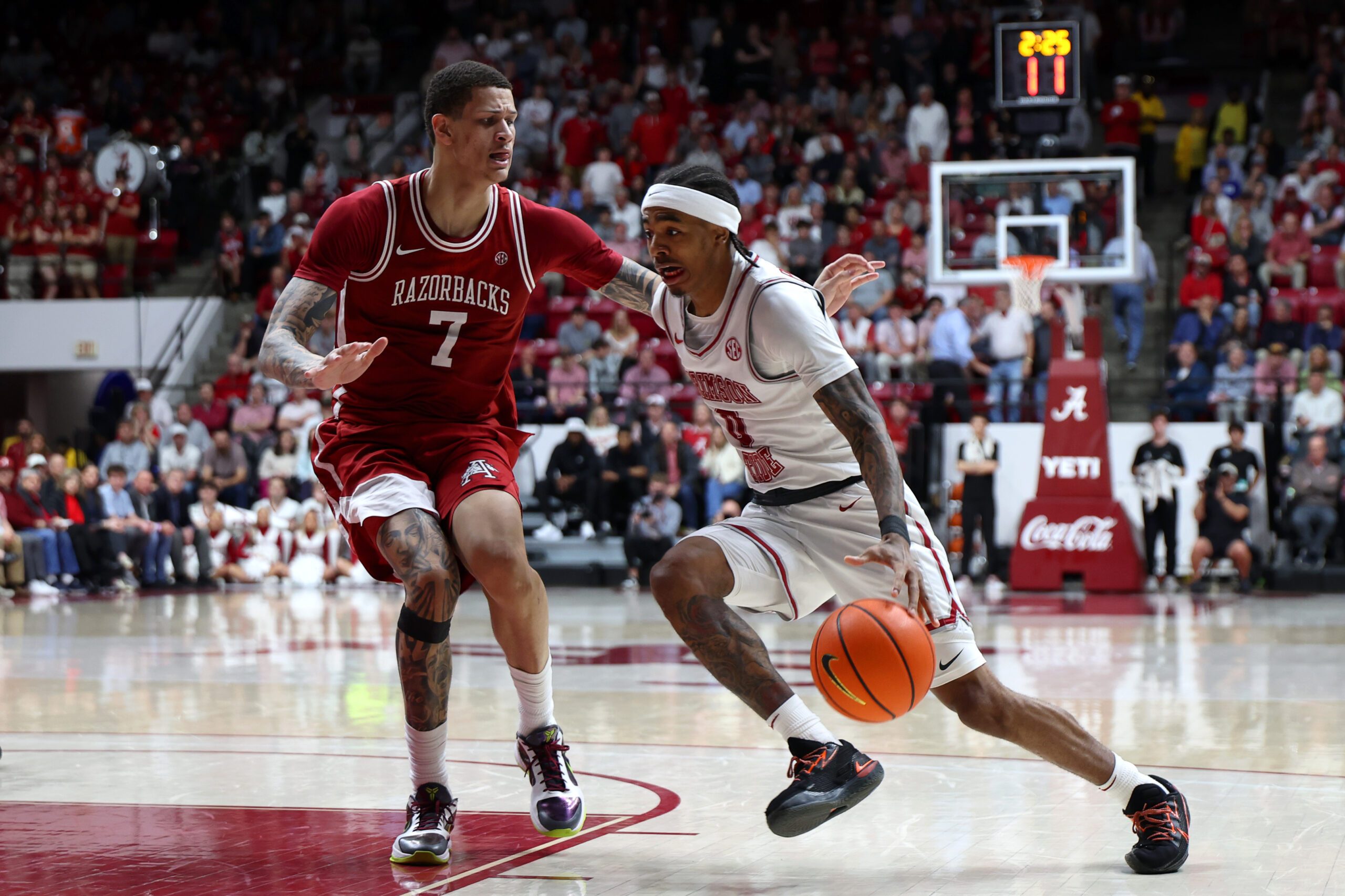 Feb 18, 2026; Tuscaloosa, Alabama, USA; Arkansas Razorback forward Trevon Brazile (7) guards Alabama Crimson Tide guard Labaron Philon (0) during the second half at Coleman Coliseum. Mandatory Credit: David Leong-Imagn Images