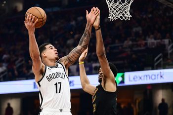 Feb 19, 2026; Cleveland, Ohio, USA; Brooklyn Nets forward Michael Porter Jr. (17) drives to the basket against Cleveland Cavaliers center Jarrett Allen (31) during the first half at Rocket Arena. Mandatory Credit: Ken Blaze-Imagn Images