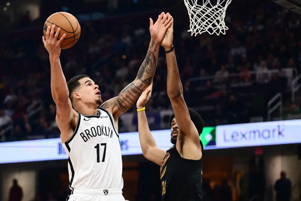 Feb 19, 2026; Cleveland, Ohio, USA; Brooklyn Nets forward Michael Porter Jr. (17) drives to the basket against Cleveland Cavaliers center Jarrett Allen (31) during the first half at Rocket Arena. Mandatory Credit: Ken Blaze-Imagn Images