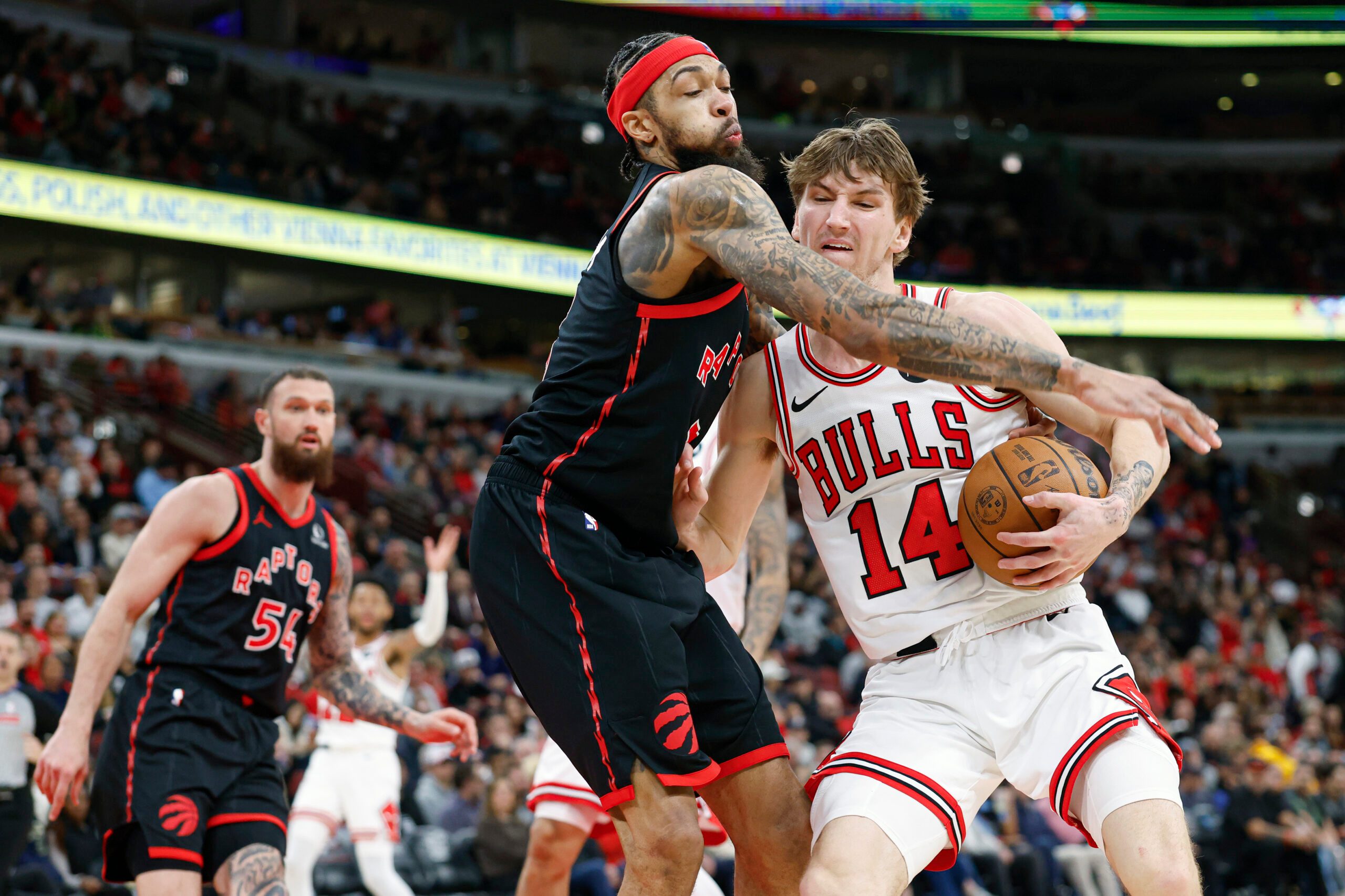 Feb 19, 2026; Chicago, Illinois, USA; Toronto Raptors forward Brandon Ingram (3) defends against Chicago Bulls forward Matas Buzelis (14) during the second half at United Center. Mandatory Credit: Kamil Krzaczynski-Imagn Images
