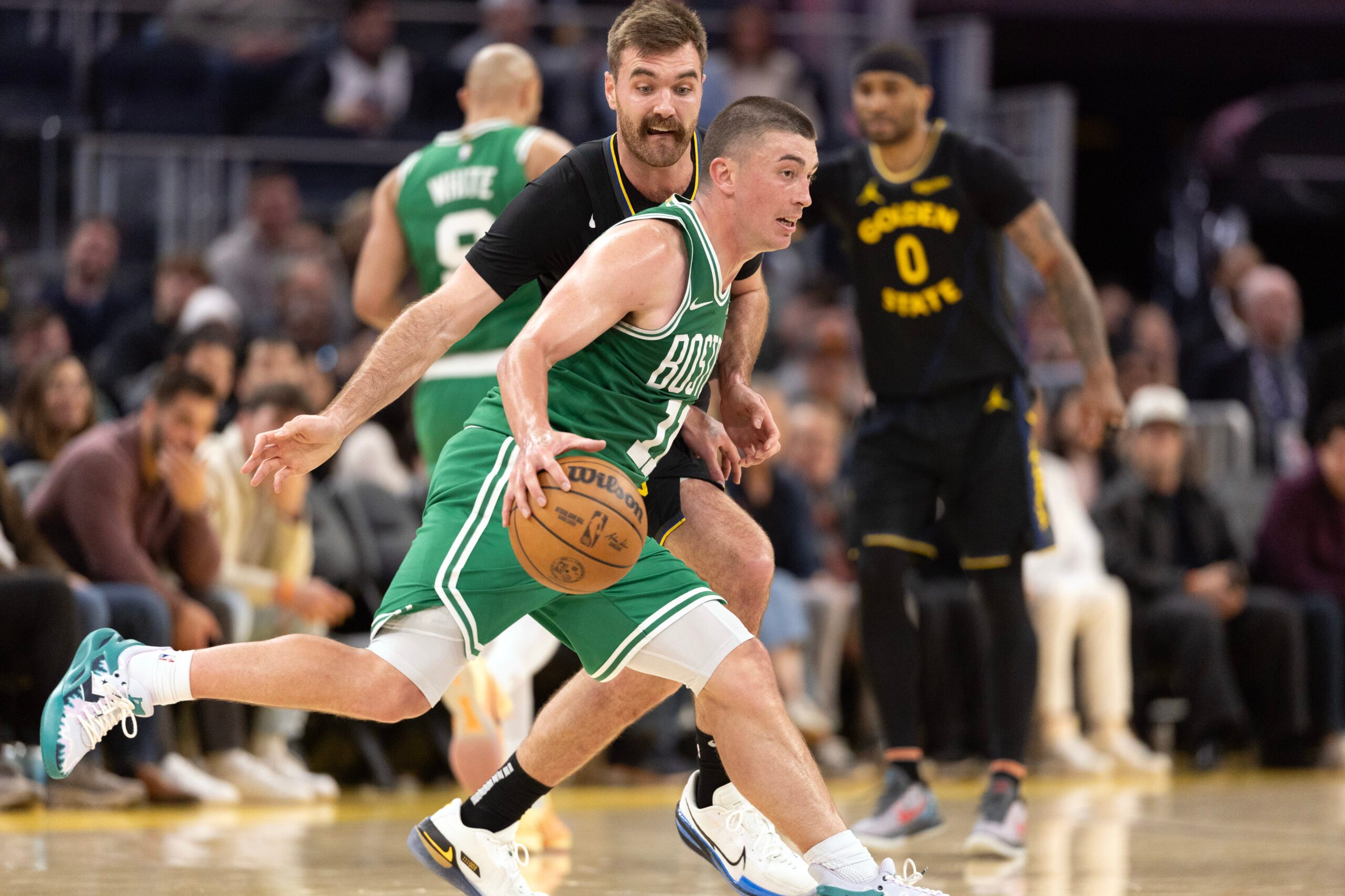 Feb 19, 2026; San Francisco, California, USA; Boston Celtics guard Payton Pritchard (11) dribbles around Golden State Warriors guard Pat Spencer (61) during the fourth quarter at Chase Center. Mandatory Credit: D. Ross Cameron-Imagn Images