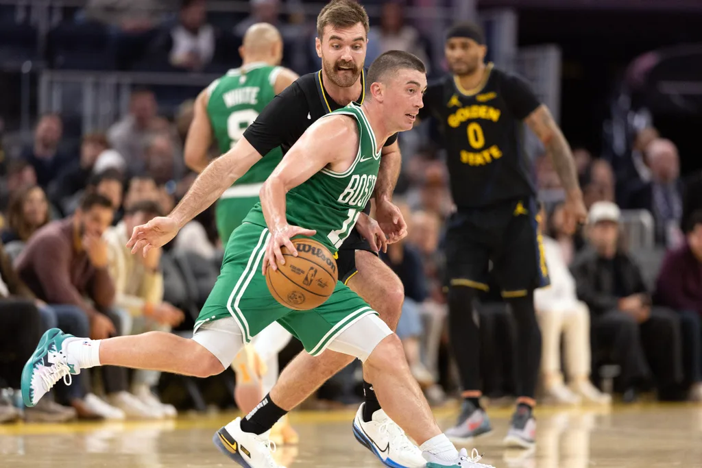 Feb 19, 2026; San Francisco, California, USA; Boston Celtics guard Payton Pritchard (11) dribbles around Golden State Warriors guard Pat Spencer (61) during the fourth quarter at Chase Center. Mandatory Credit: D. Ross Cameron-Imagn Images