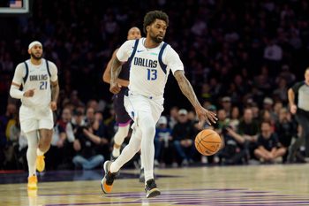 Feb 20, 2026; Minneapolis, Minnesota, USA; Dallas Mavericks forward Naji Marshall (13) dribbles against the Minnesota Timberwolves in the first quarter at Target Center. Mandatory Credit: Matt Blewett-Imagn Images