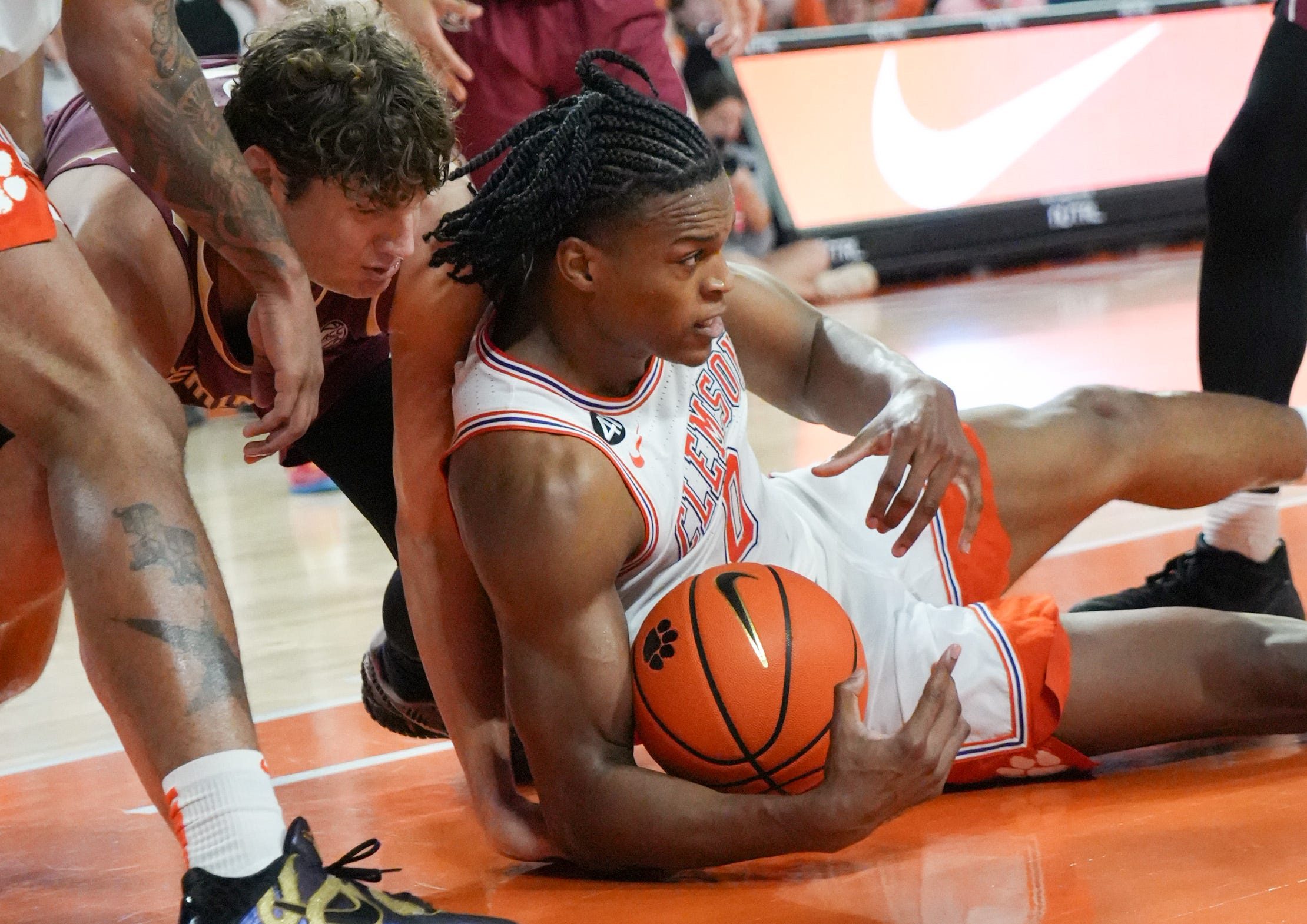Clemson sophomore forward RJ Godfrey (0) recovers a loose ball near Florida State University forward Alex Steen (25) during the second half at Littlejohn Coliseum in Clemson, S.C Saturday, February 21, 2026.