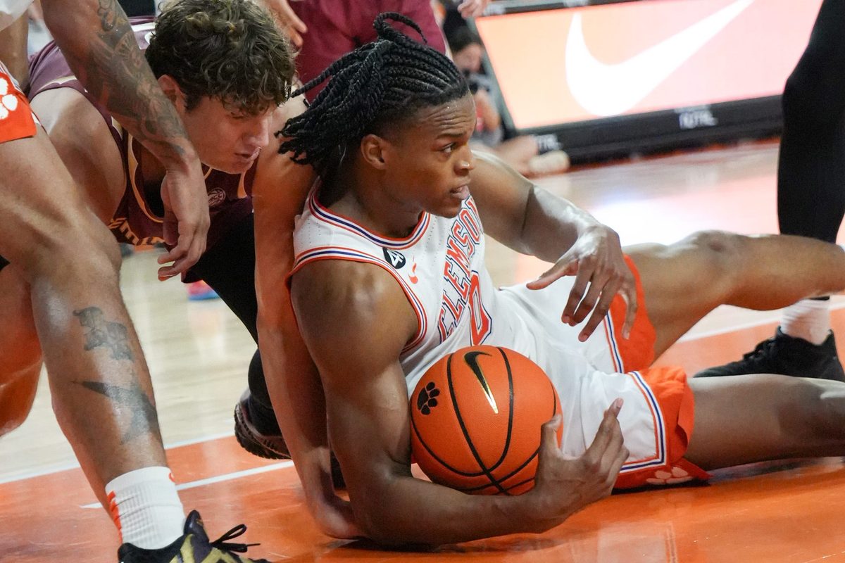 Clemson sophomore forward RJ Godfrey (0) recovers a loose ball near Florida State University forward Alex Steen (25) during the second half at Littlejohn Coliseum in Clemson, S.C Saturday, February 21, 2026.